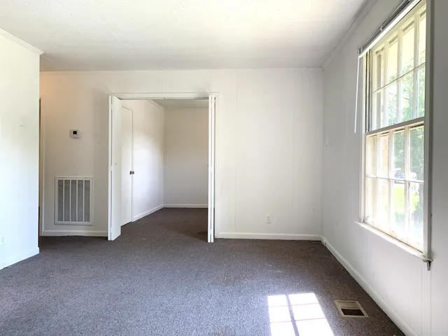 an empty room with windows