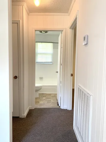 an empty room with wooden door