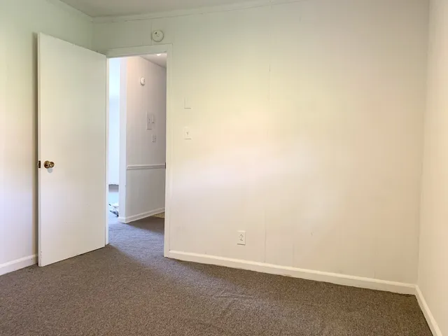an empty room with a empty space and window