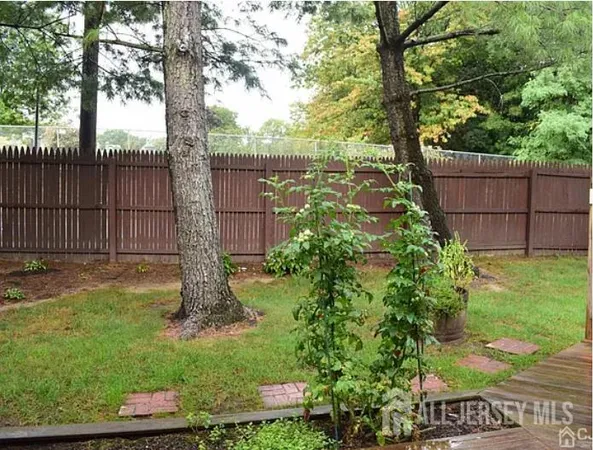 a garden with wooden fence