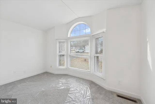 an empty room with windows