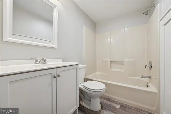 a bathroom with a sink toilet and bathtub