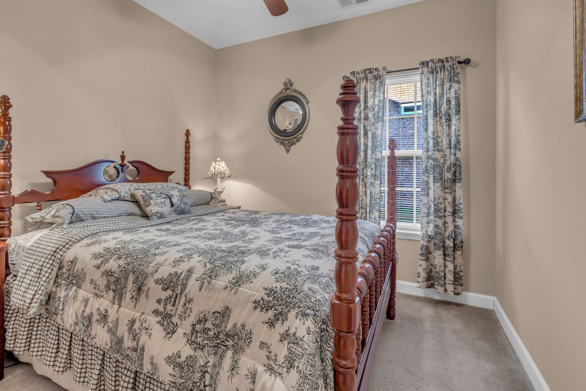 4549 Boxcroft Circle Mount Juliet, TN 37122 - Photo 18 of 28 a bedroom with a bed and a chandelier