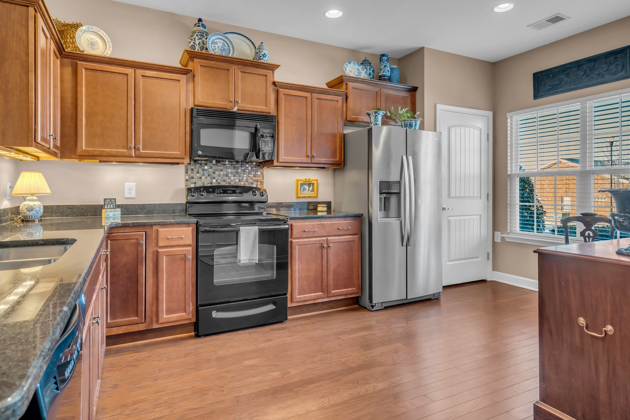 4549 Boxcroft Circle Mount Juliet, TN 37122 - Photo 4 of 28 a kitchen with stainless steel appliances granite countertop a stove a refrigerator and a refrigerator
