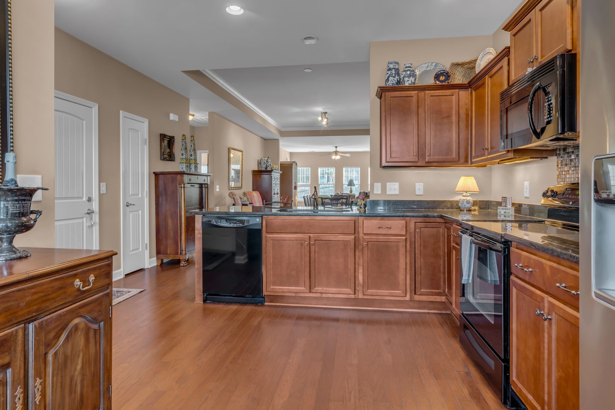 4549 Boxcroft Circle Mount Juliet, TN 37122 - Photo 5 of 28 a kitchen with stainless steel appliances granite countertop a refrigerator oven a sink dishwasher and wooden cabinets with wooden floor