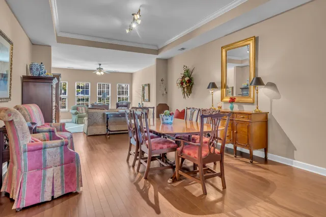 a view of a dining room with furniture and wooden floor