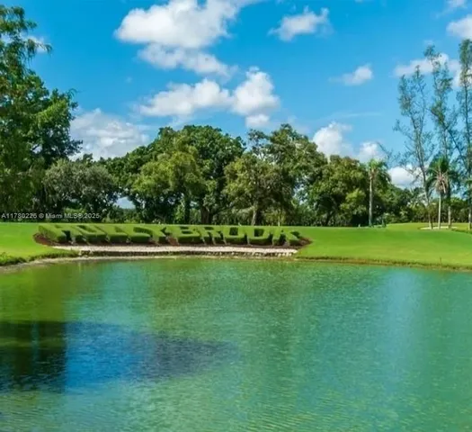 a view of a golf course with a lake