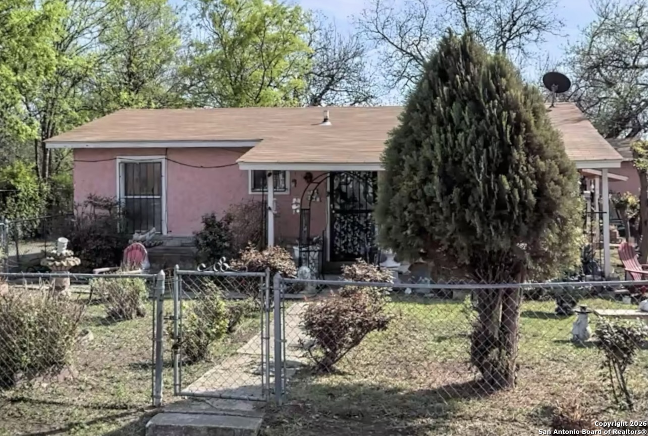a view of house with yard