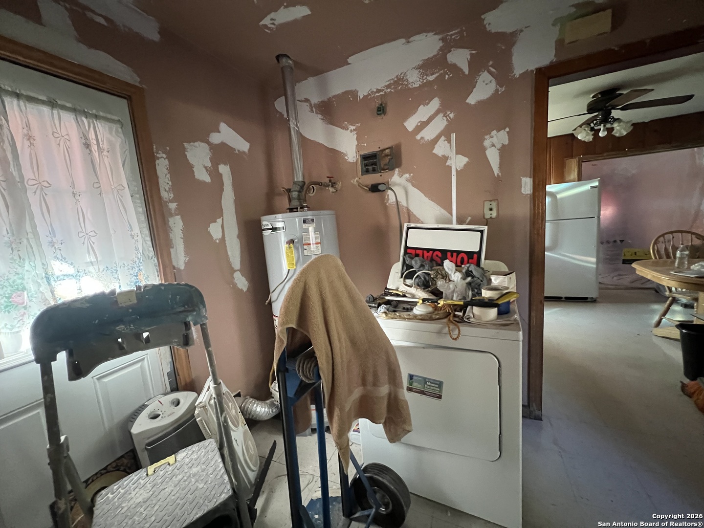 1338 Merida Street San Antonio, TX 78207 - Photo 3 of 16 a view of a workspace with furniture and a flat screen tv