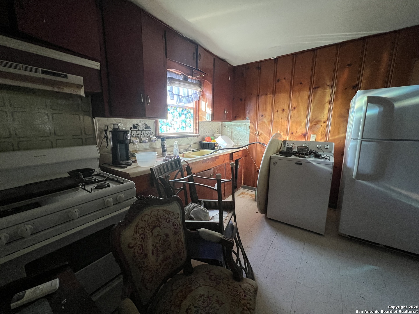 1338 Merida Street San Antonio, TX 78207 - Photo 6 of 16 a kitchen with sink refrigerator and window
