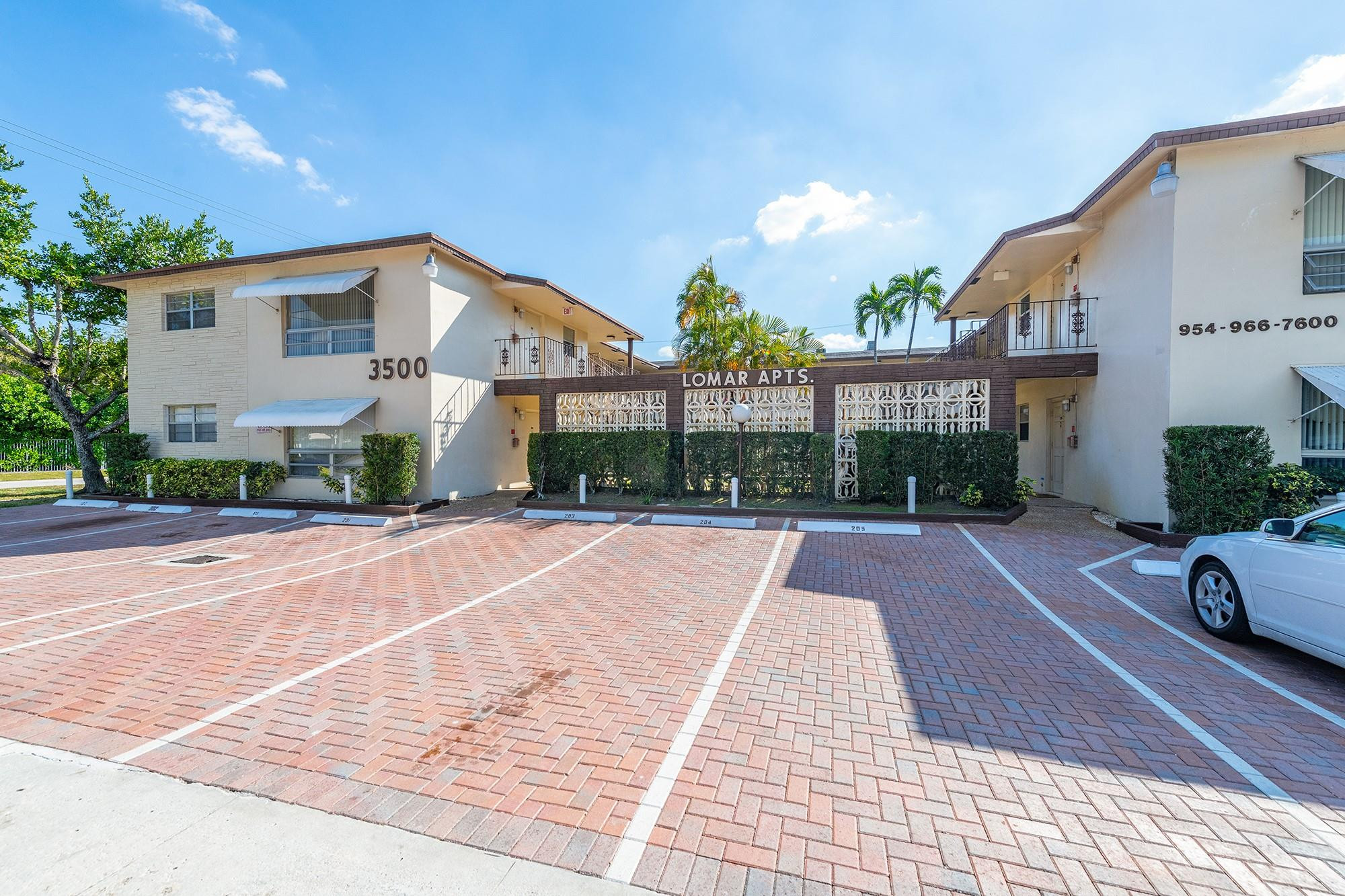 3500 Jackson Street, Unit 105 Hollywood, FL 33021 - Photo 1 of 14 a view of a house with a yard