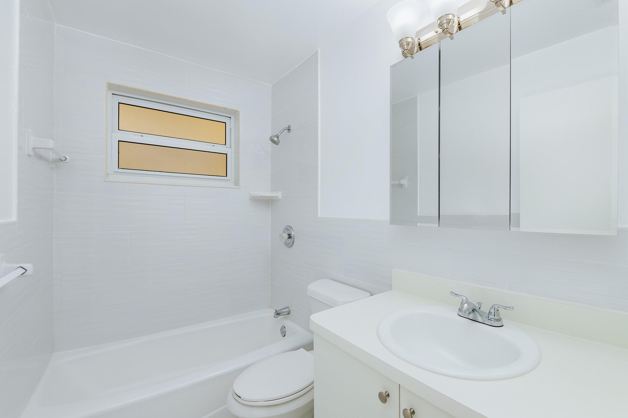 3500 Jackson Street, Unit 105 Hollywood, FL 33021 - Photo 11 of 14 a bathroom with a sink a toilet and shower