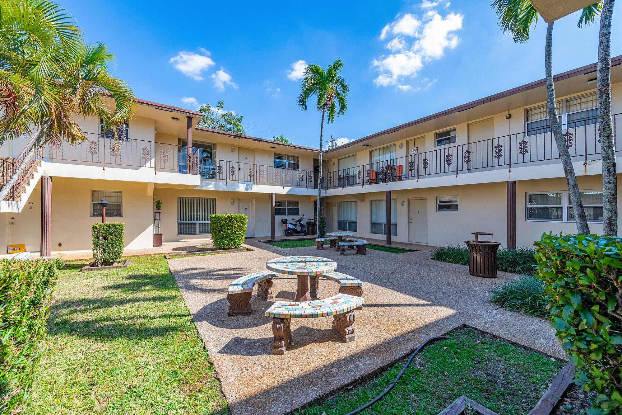 3500 Jackson Street, Unit 105 Hollywood, FL 33021 - Photo 4 of 14 a view of a house with swimming pool and sitting area