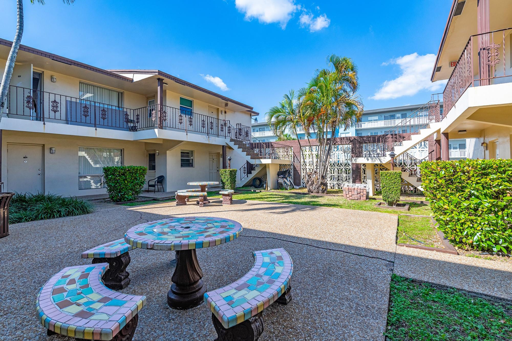 3500 Jackson Street, Unit 105 Hollywood, FL 33021 - Photo 5 of 14 a swimming pool with outdoor seating and yard