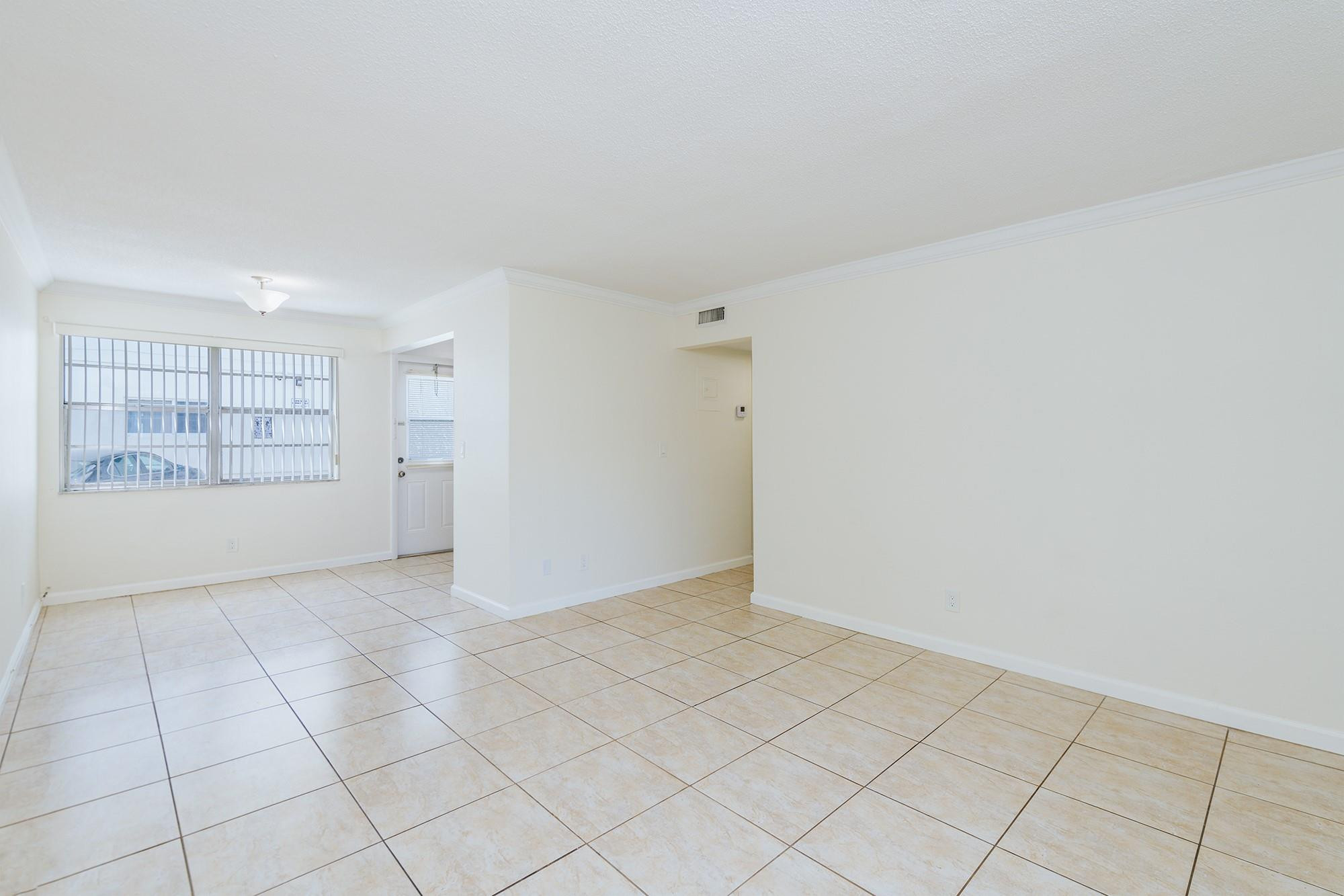 3500 Jackson Street, Unit 105 Hollywood, FL 33021 - Photo 6 of 14 an empty room with windows