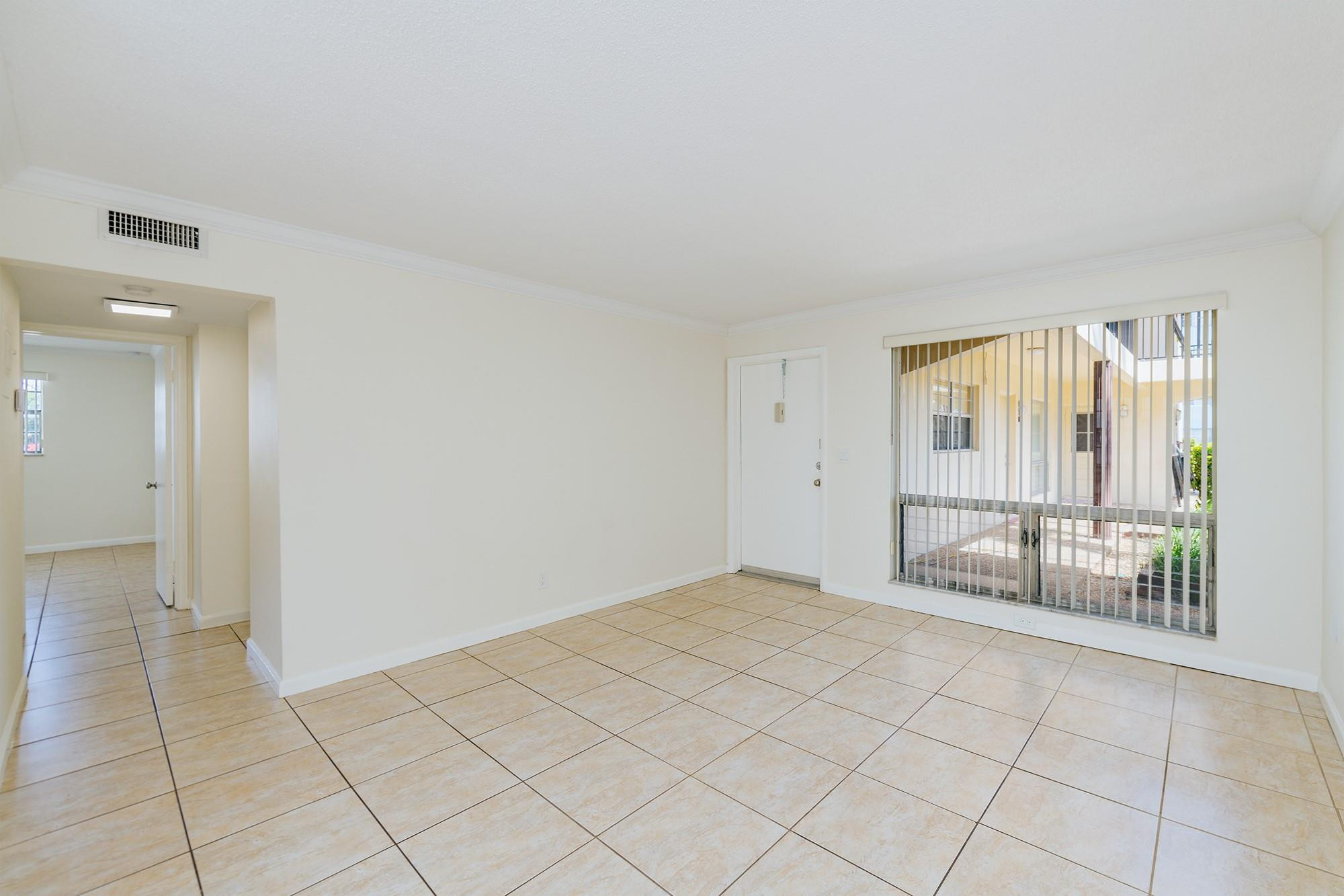 3500 Jackson Street, Unit 105 Hollywood, FL 33021 - Photo 7 of 14 an empty room with windows