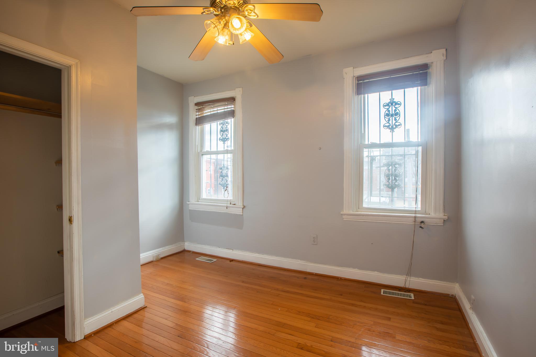 1117 I Street Northeast Washington, DC 20002 - Photo 13 of 23 an empty room with wooden floor and windows