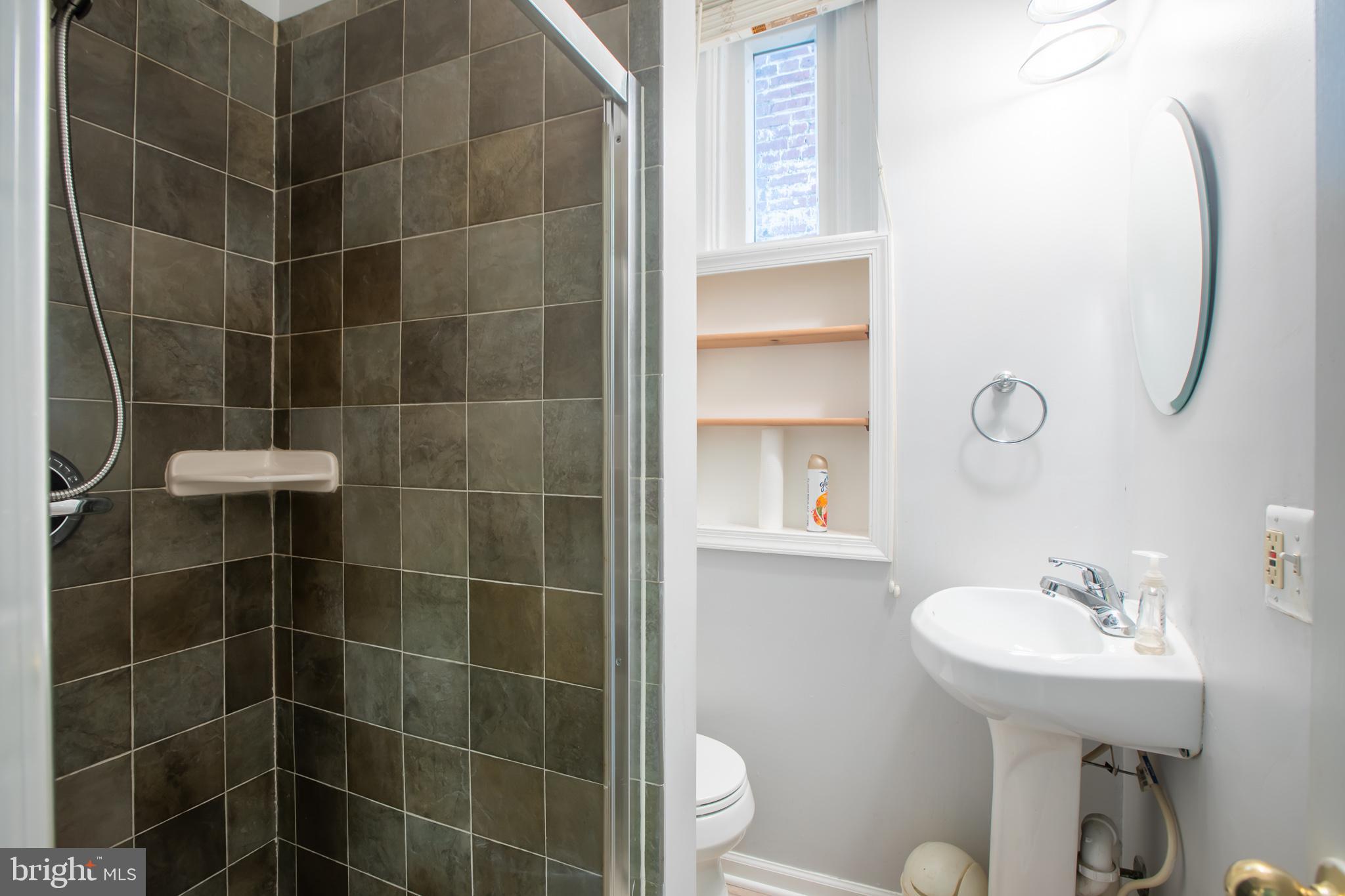 1117 I Street Northeast Washington, DC 20002 - Photo 18 of 23 a bathroom with a sink toilet and shower