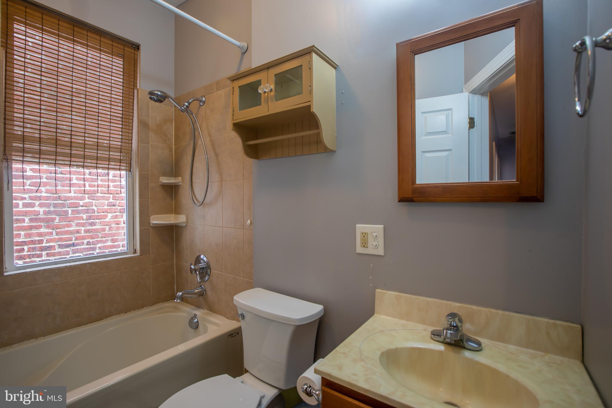 1117 I Street Northeast Washington, DC 20002 - Photo 19 of 23 a bathroom with a toilet a sink and bathtub