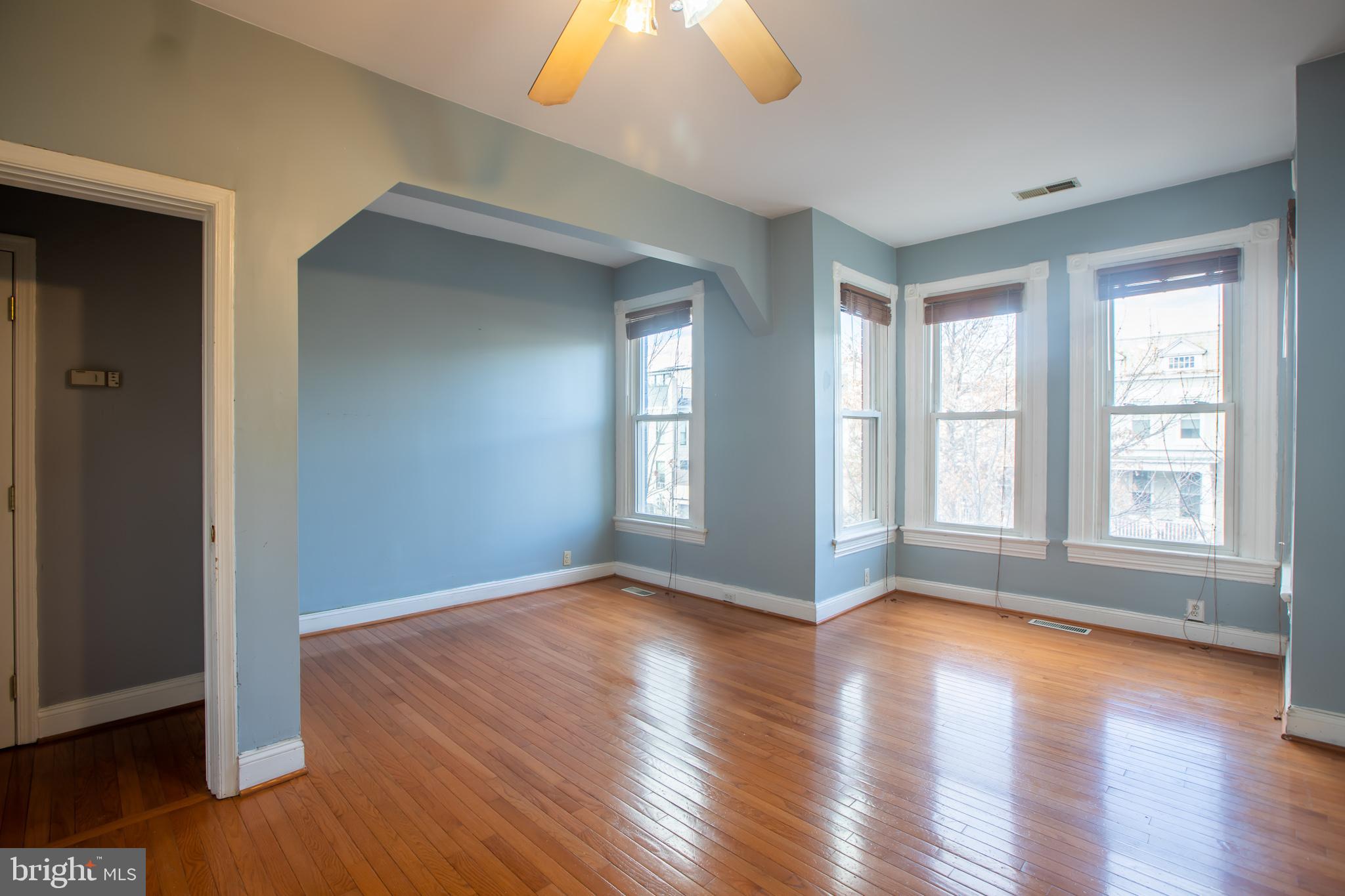1117 I Street Northeast Washington, DC 20002 - Photo 8 of 23 a view of an empty room with wooden floor and a window