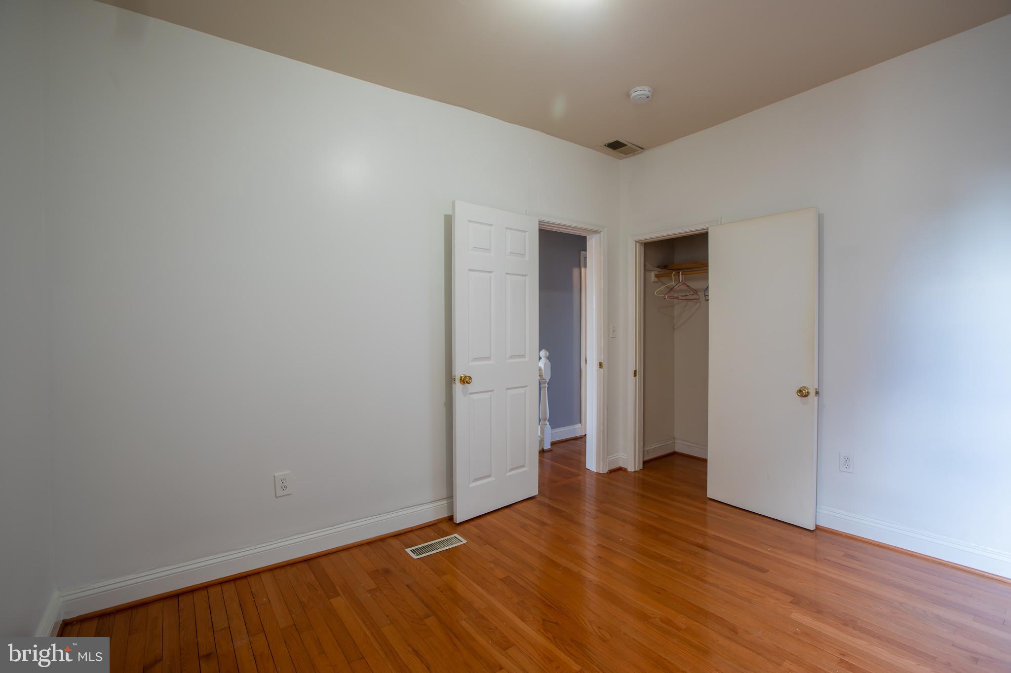 1117 I Street Northeast Washington, DC 20002 - Photo 10 of 23 a view of an empty room with wooden floor
