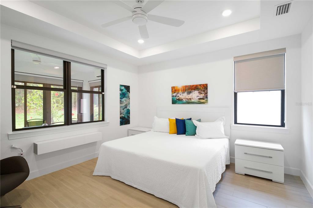 6713 Alstead Circle Lakewood Ranch, FL 34202 - Photo 17 of 35 a bedroom with a bed and a large window