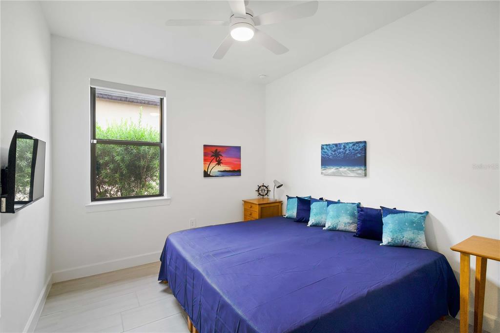 6713 Alstead Circle Lakewood Ranch, FL 34202 - Photo 21 of 35 a bedroom with a bed and window