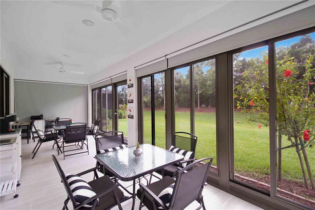 6713 Alstead Circle Lakewood Ranch, FL 34202 - Photo 27 of 35 a view of a dining room with furniture window and outside view