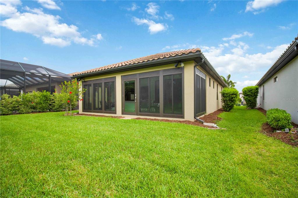 6713 Alstead Circle Lakewood Ranch, FL 34202 - Photo 28 of 35 a view of a house with a backyard
