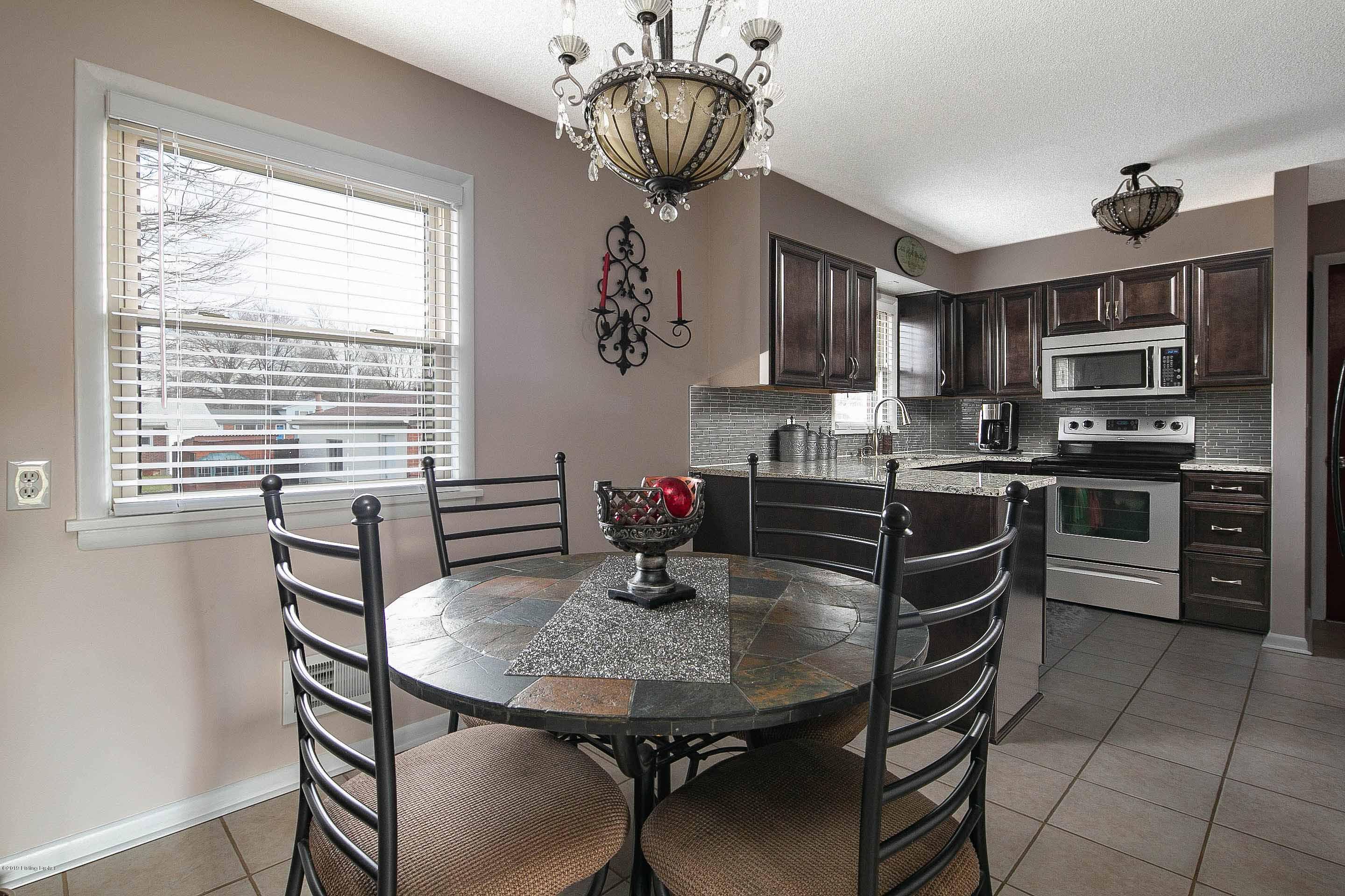 9328 Fairground Road Louisville, KY 40291 - Photo 1 of 26 Enjoy dinners at home in this beautifully updated eat-in kitchen with stunning cabinetry, granite counter tops, and stainless steel appliances.