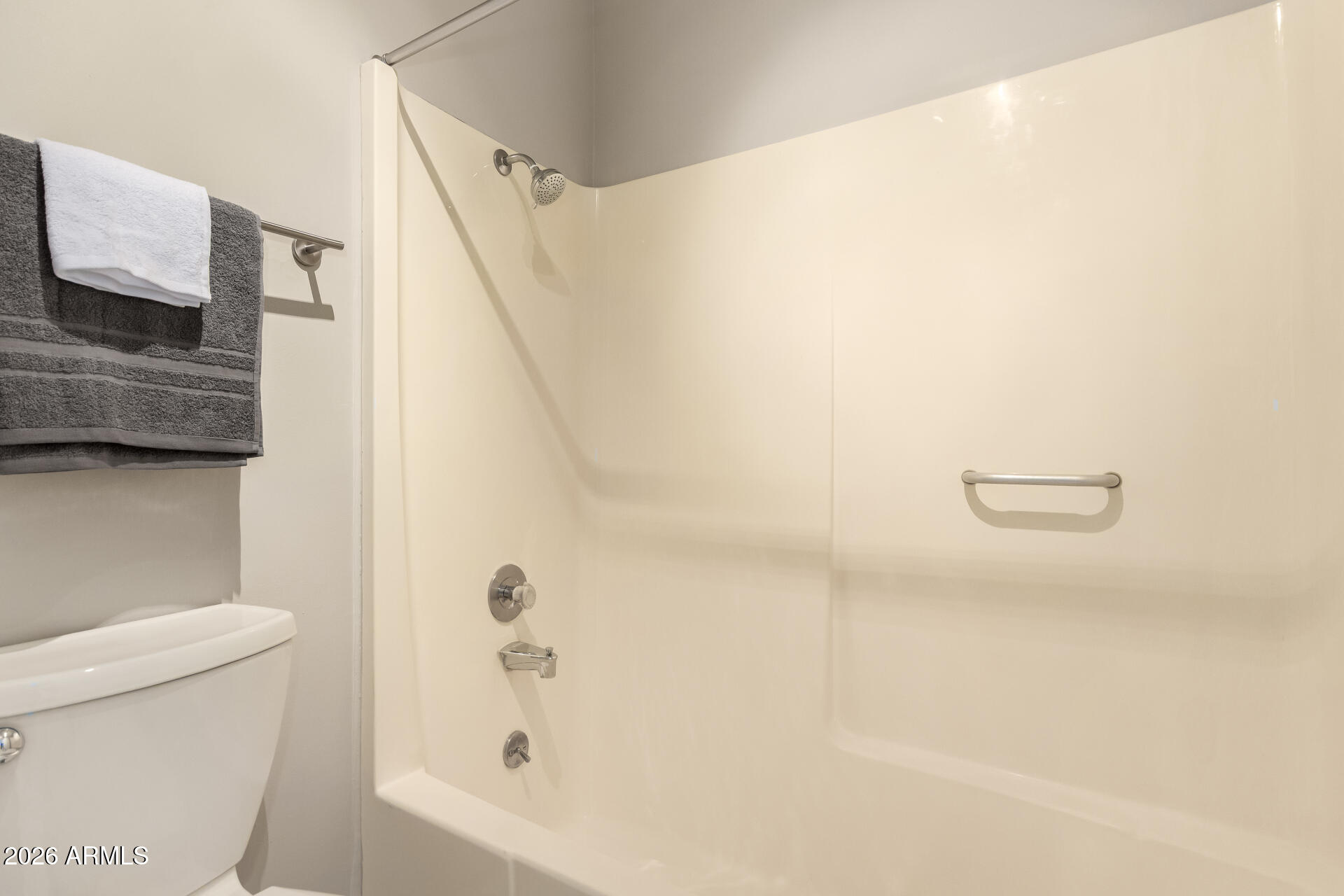 1833 West Citrus Way Phoenix, AZ 85015 - Photo 12 of 36 a bathroom with a bathtub and a toilet