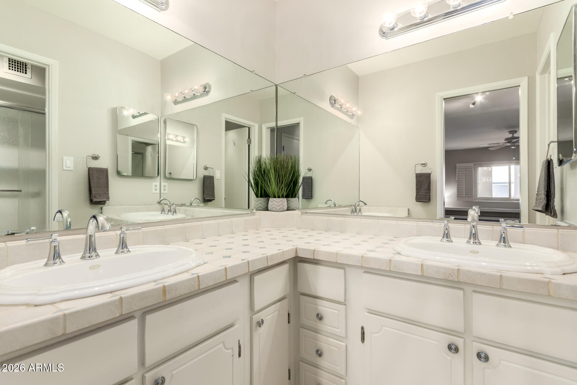 1833 West Citrus Way Phoenix, AZ 85015 - Photo 18 of 36 a bathroom with a sink double vanity and a mirror