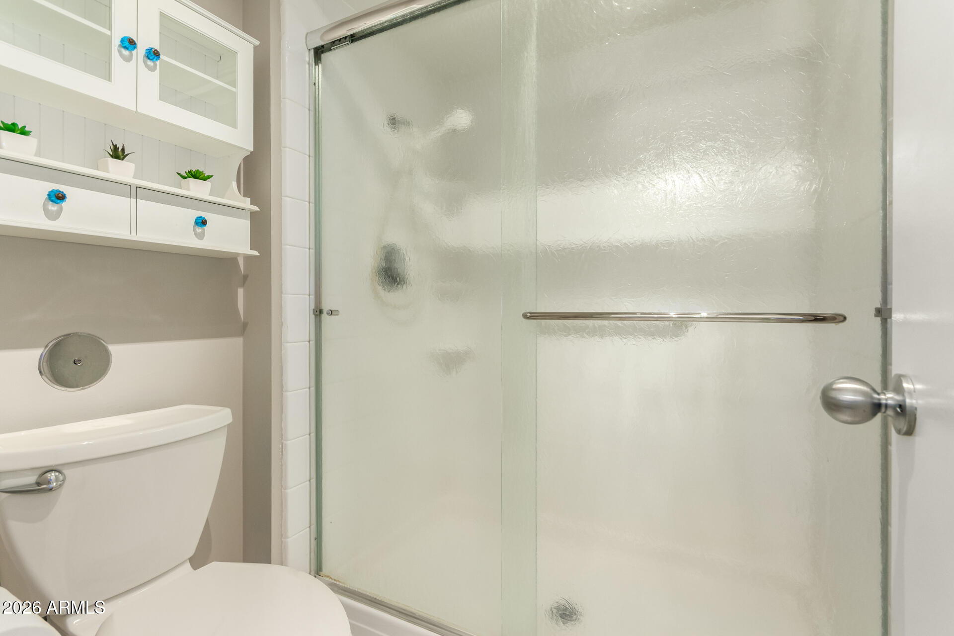 1833 West Citrus Way Phoenix, AZ 85015 - Photo 19 of 36 a white toilet sitting next to a bathroom sink