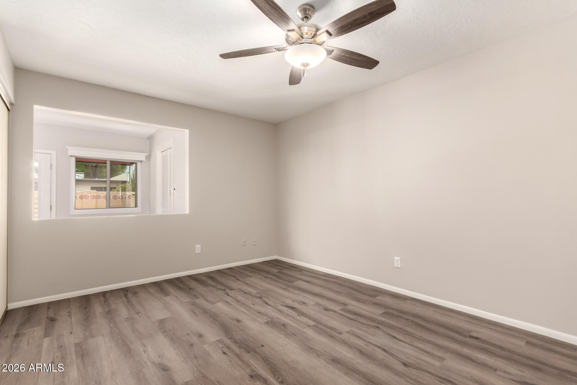 1833 West Citrus Way Phoenix, AZ 85015 - Photo 20 of 36 wooden floor in an empty room with a window