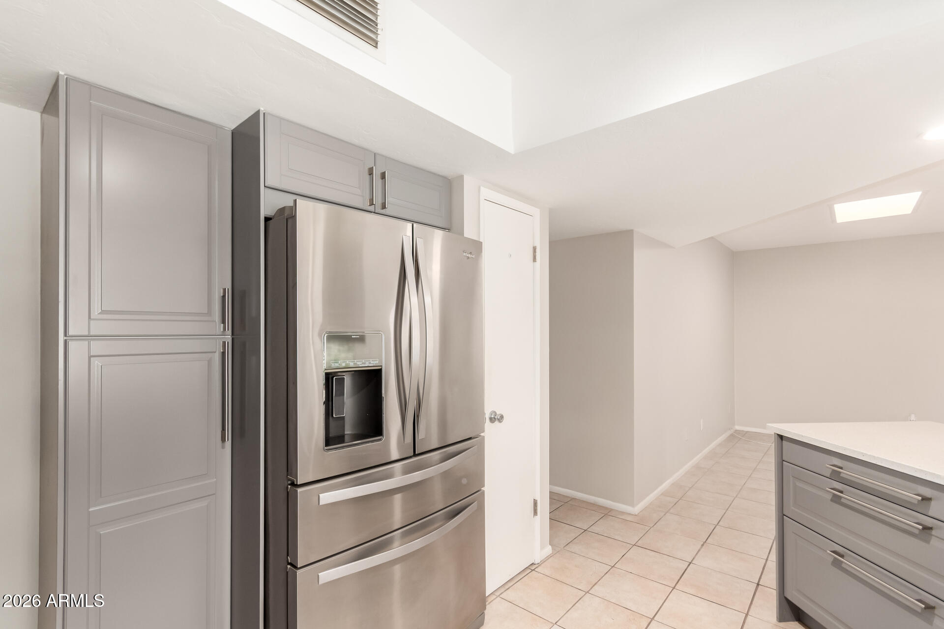 1833 West Citrus Way Phoenix, AZ 85015 - Photo 22 of 36 a kitchen with a refrigerator and cabinets