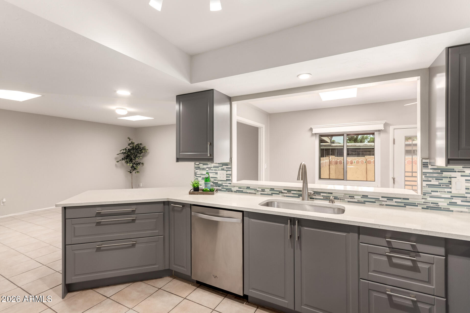 1833 West Citrus Way Phoenix, AZ 85015 - Photo 23 of 36 a bathroom with a granite countertop sink mirror and window