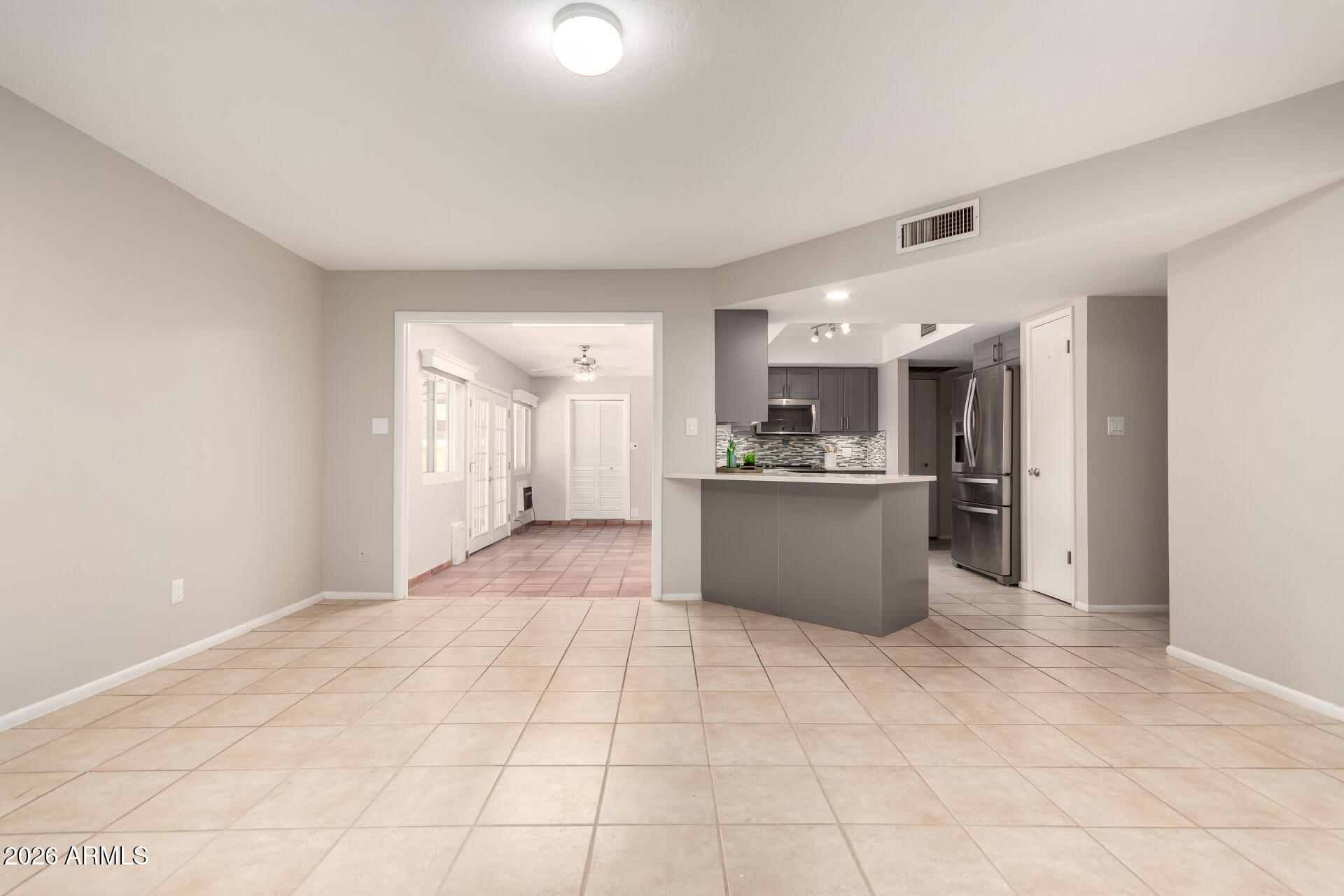 1833 West Citrus Way Phoenix, AZ 85015 - Photo 30 of 36 a view of a kitchen with kitchen island white cabinetry