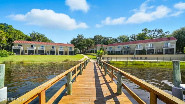 a kitchen with stainless steel appliances granite countertop a stove a microwave and a refrigerator