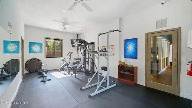 an aerial view of house with yard and lake view