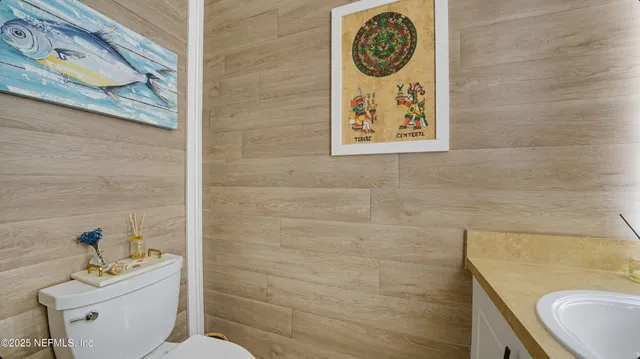 a kitchen with stainless steel appliances a sink a stove and cabinets