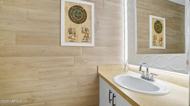 a kitchen with granite countertop a stove and a sink