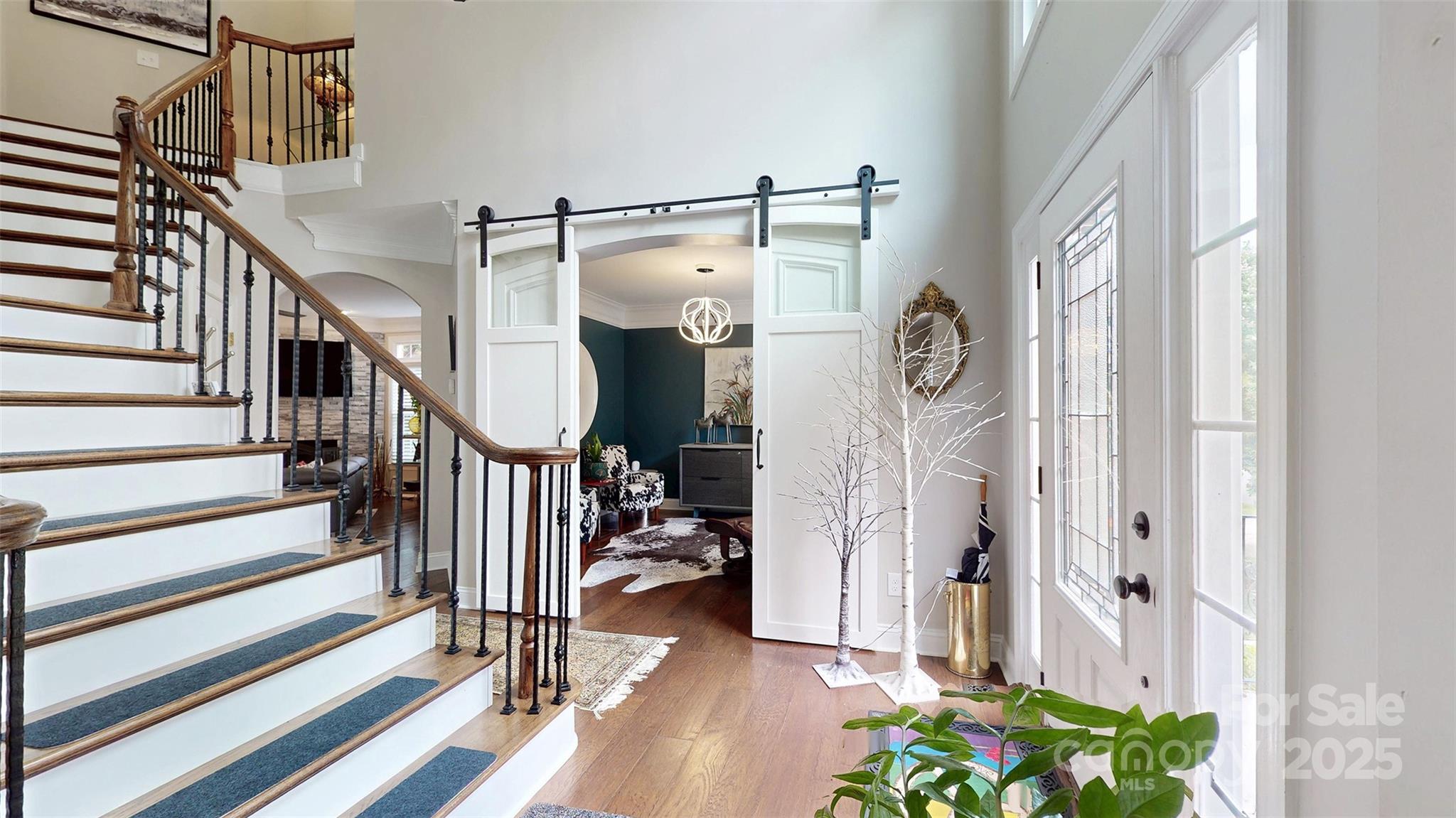 9014 Cardinal Ridge Court Charlotte, NC 28270 - Photo 12 of 45 a view of an entryway with wooden floor and stairs