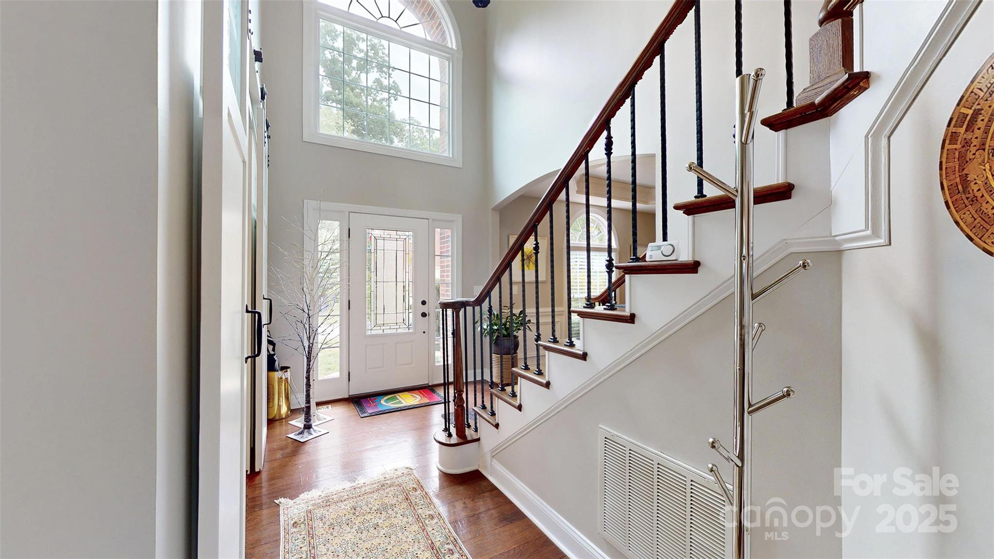 9014 Cardinal Ridge Court Charlotte, NC 28270 - Photo 13 of 45 a view of entryway and hall with wooden floor