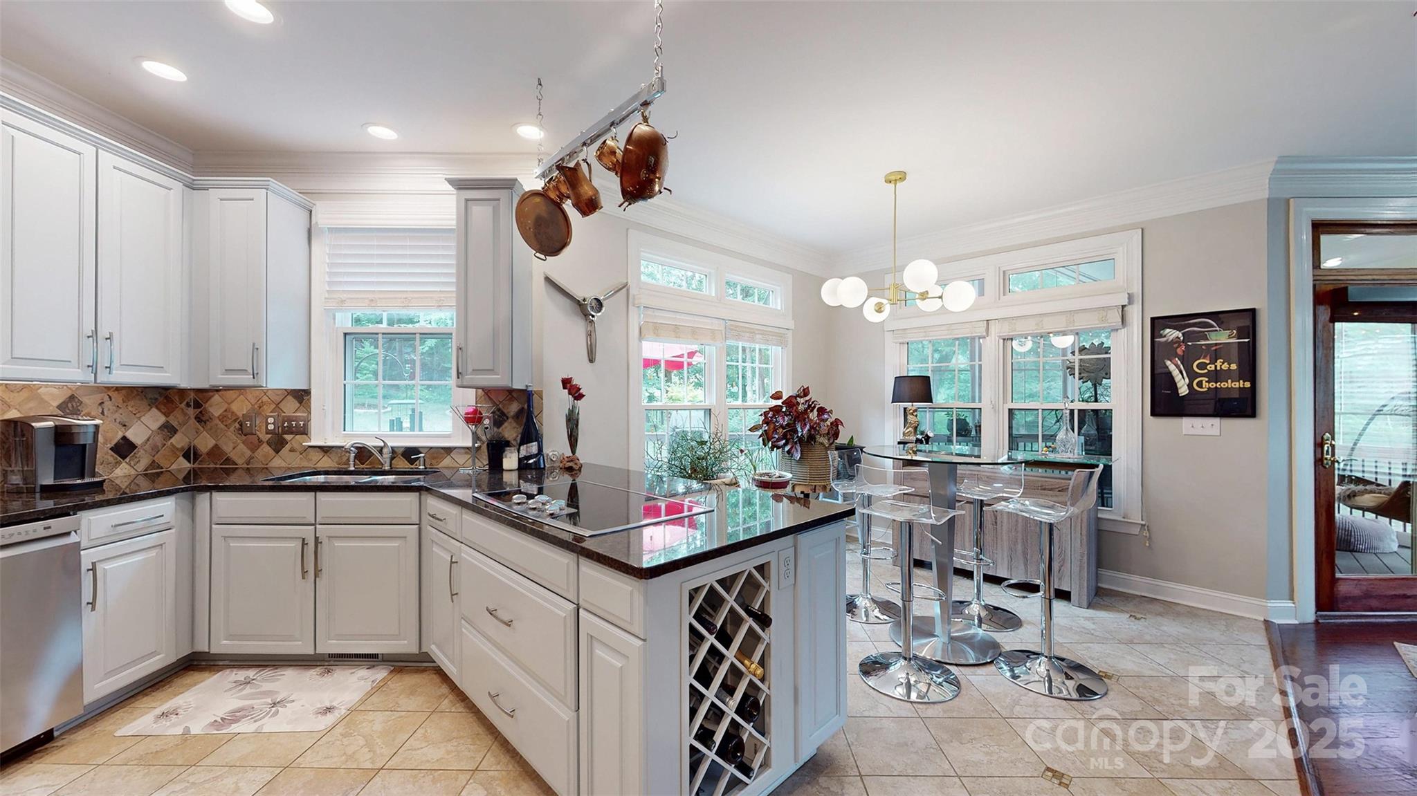 9014 Cardinal Ridge Court Charlotte, NC 28270 - Photo 24 of 45 a kitchen with a sink stove and cabinets