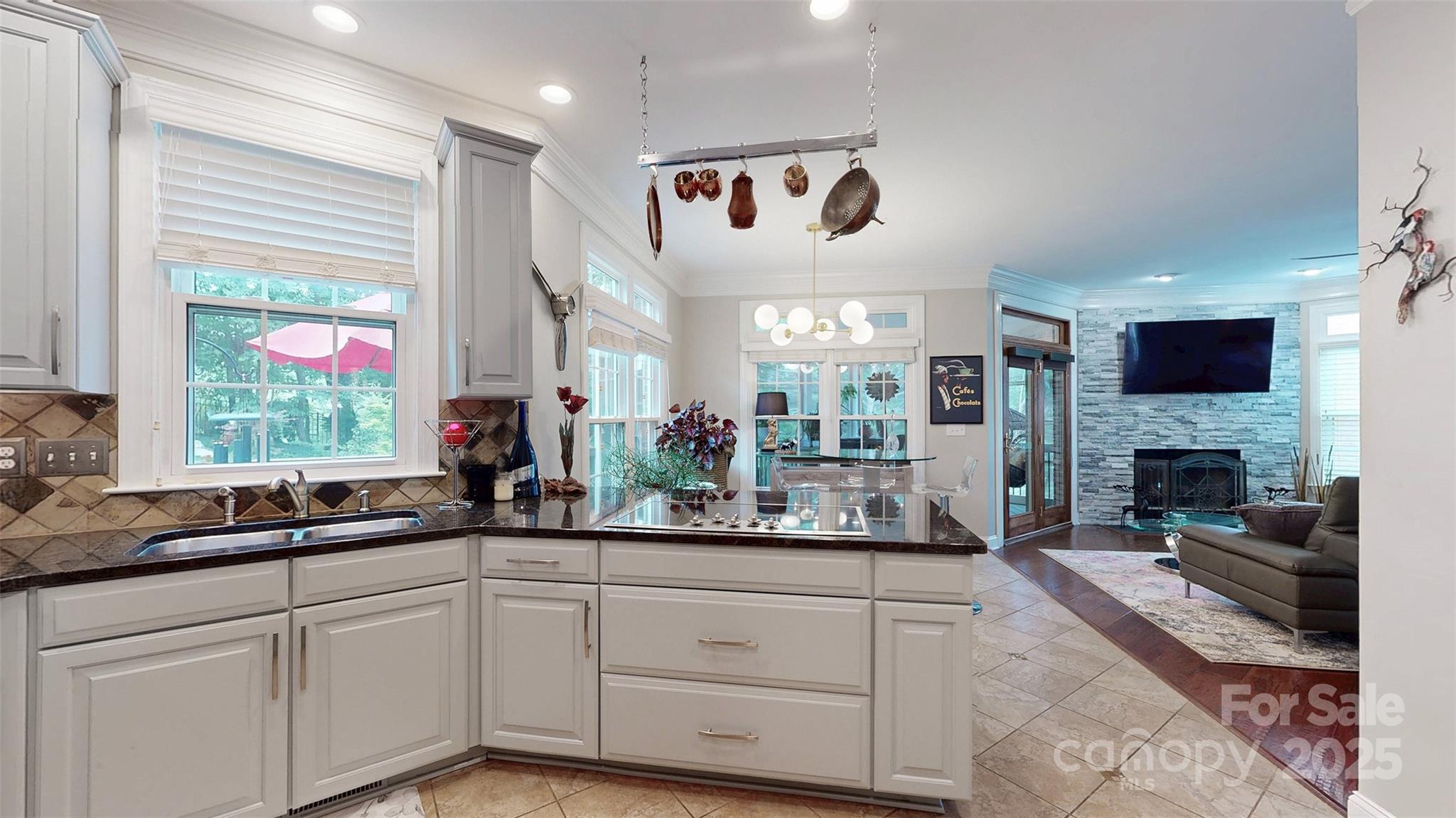 9014 Cardinal Ridge Court Charlotte, NC 28270 - Photo 26 of 45 a very nice looking living room with a fireplace and a large window