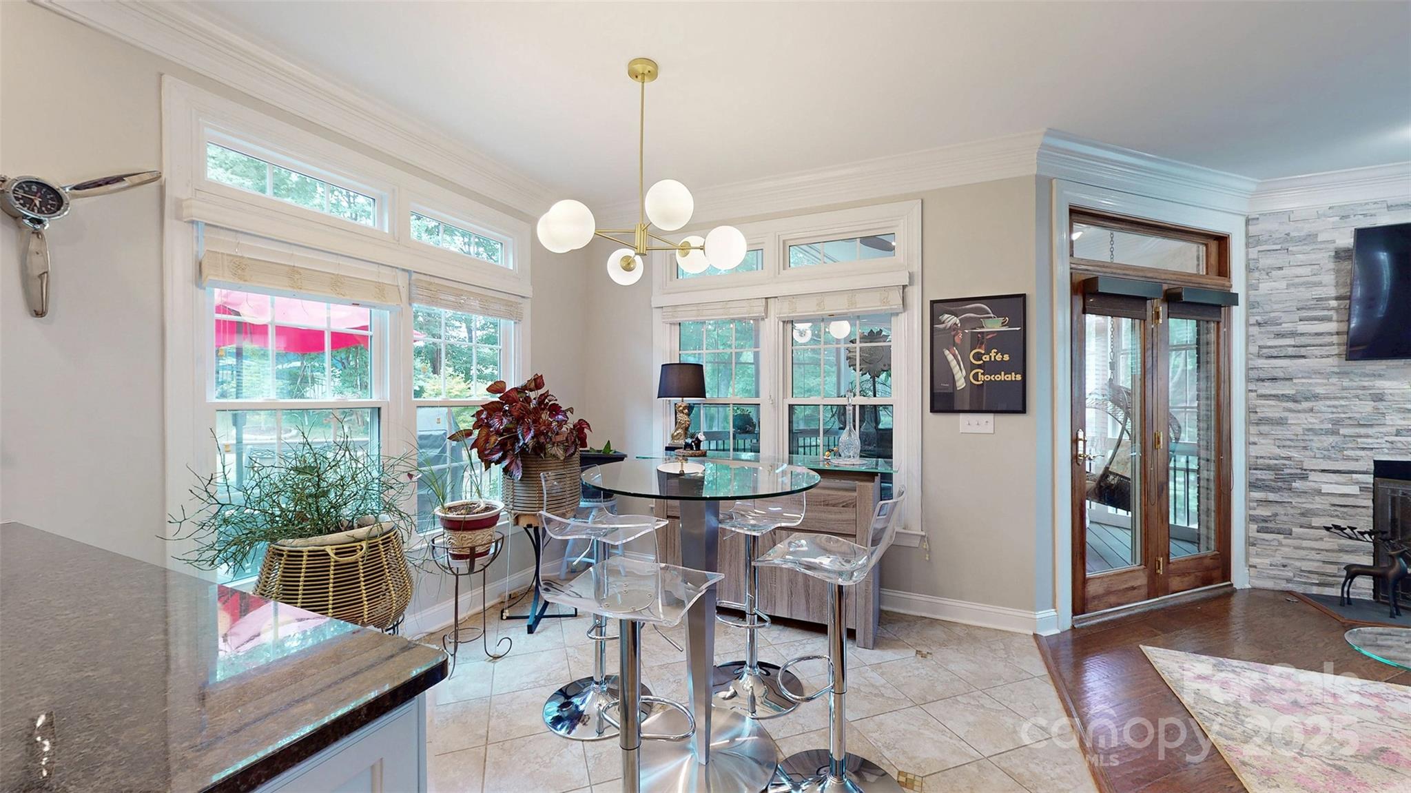 9014 Cardinal Ridge Court Charlotte, NC 28270 - Photo 29 of 45 a view of a dining room and livingroom with furniture wooden floor a chandelier