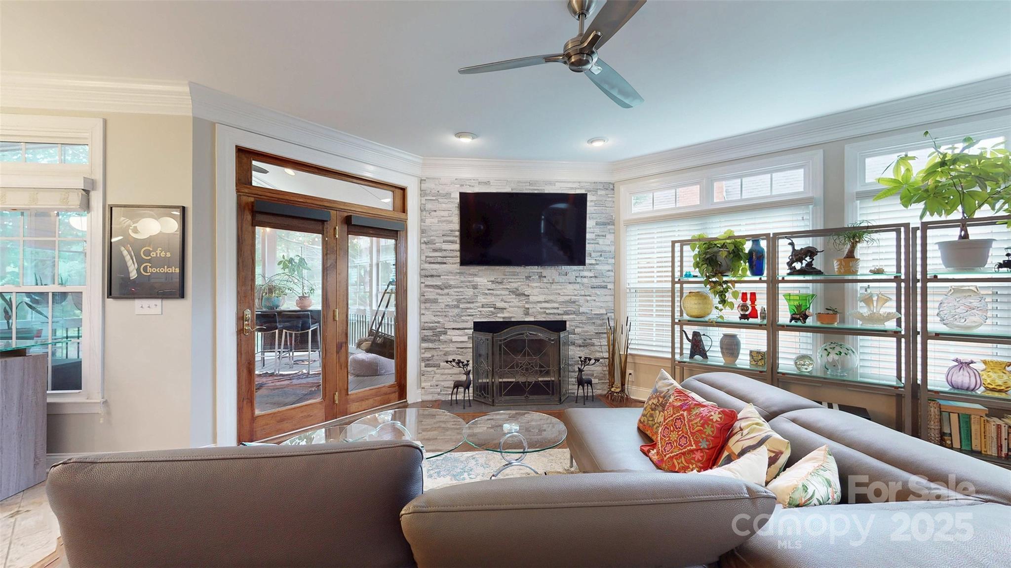 9014 Cardinal Ridge Court Charlotte, NC 28270 - Photo 32 of 45 a living room with furniture a fireplace and a flat screen tv