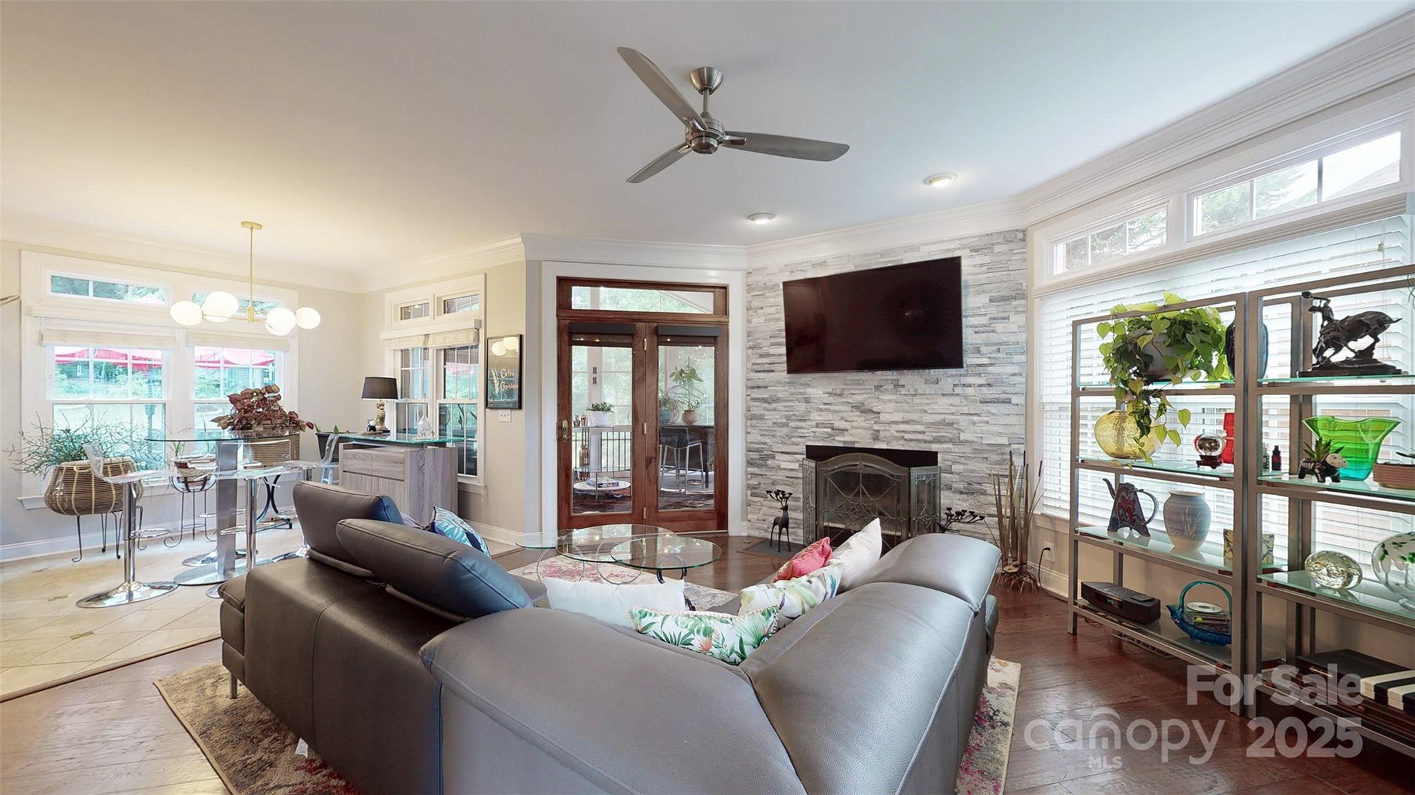 9014 Cardinal Ridge Court Charlotte, NC 28270 - Photo 33 of 45 a living room with furniture a fireplace and a flat screen tv