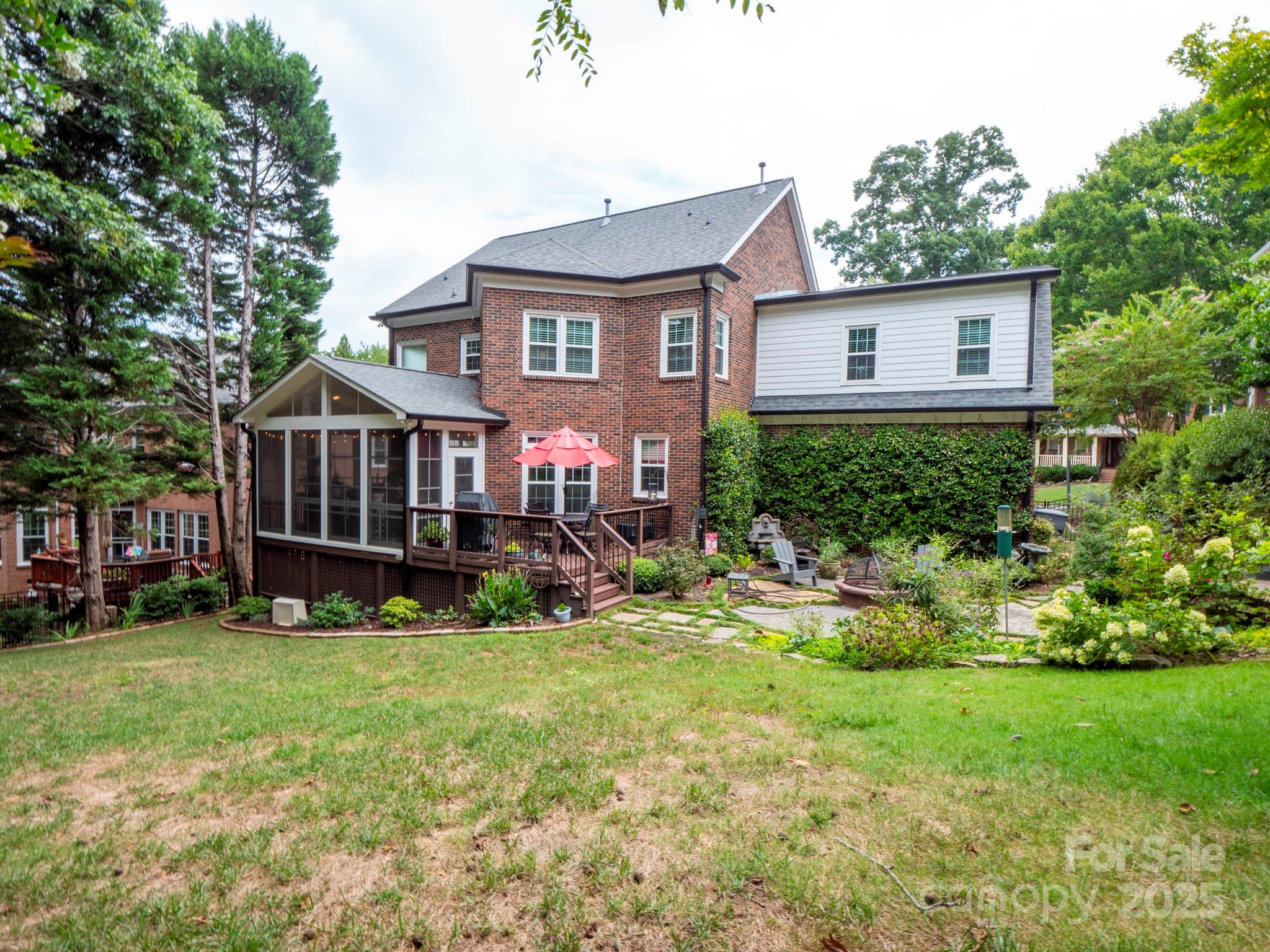 9014 Cardinal Ridge Court Charlotte, NC 28270 - Photo 7 of 45 a view of a house with a yard and sitting area
