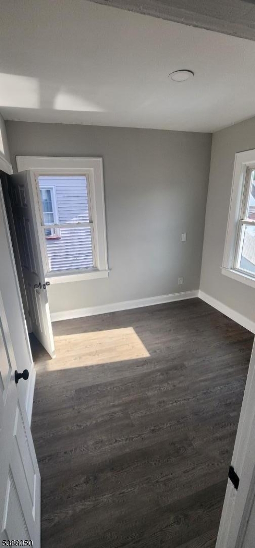 530 Drake Avenue Roselle, NJ 07203 - Photo 12 of 19 a view of empty room with window and wooden floor